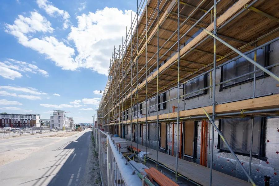 Large construction project with grid overlays and key metrics