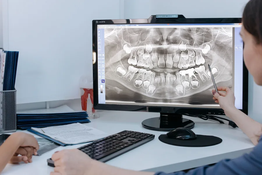 Confident patient portrait in a bright dental clinic