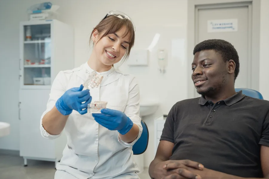 Confident patient portrait in a bright dental clinic